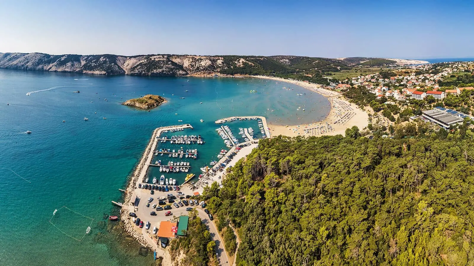 Rajska beach in Croatia with marina view