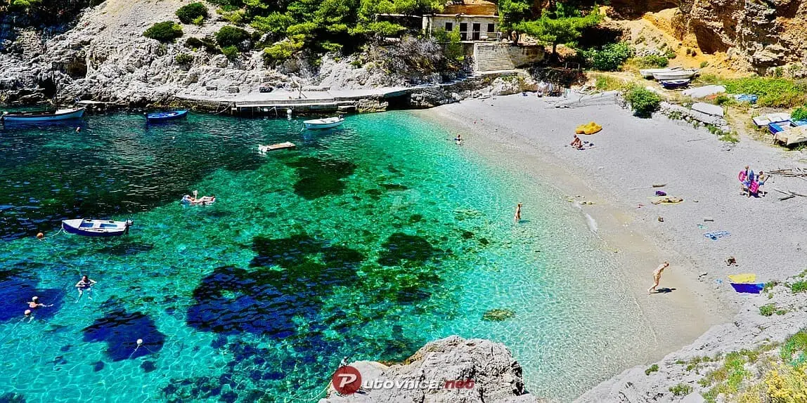 Sutmiholjska beach in Croatia with people swimming and sun bathing