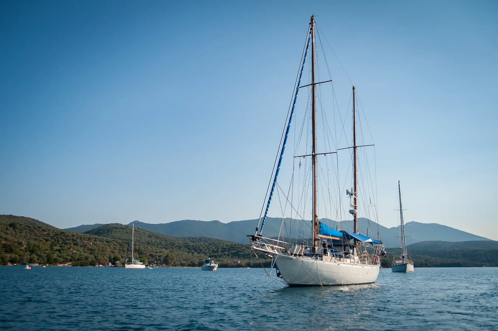 Boat on a sea with mountaint in the background