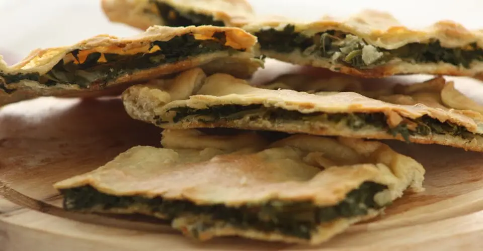 Soparnik served on a wooden board