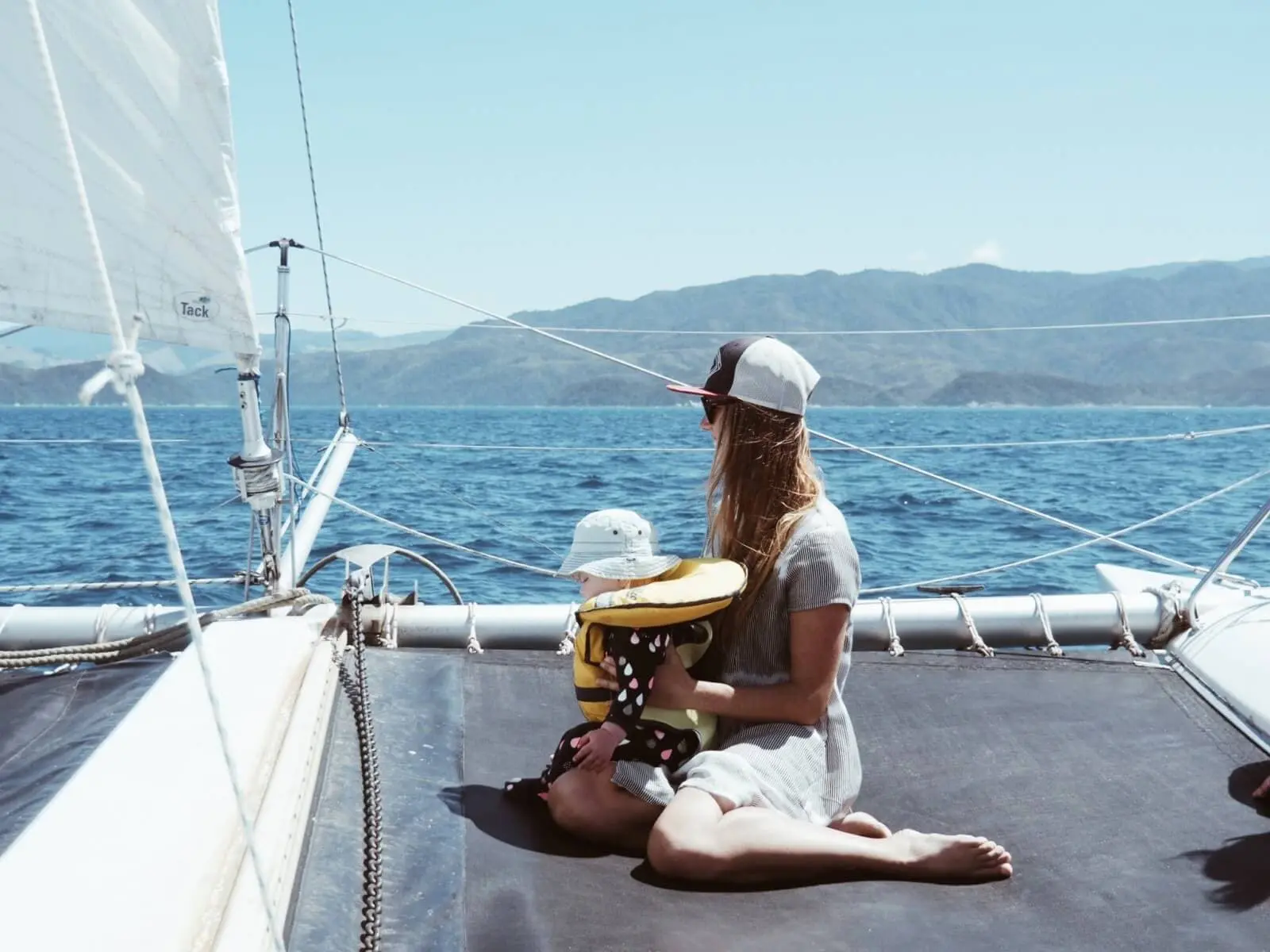 Mother and child sitting on a boat while sailing