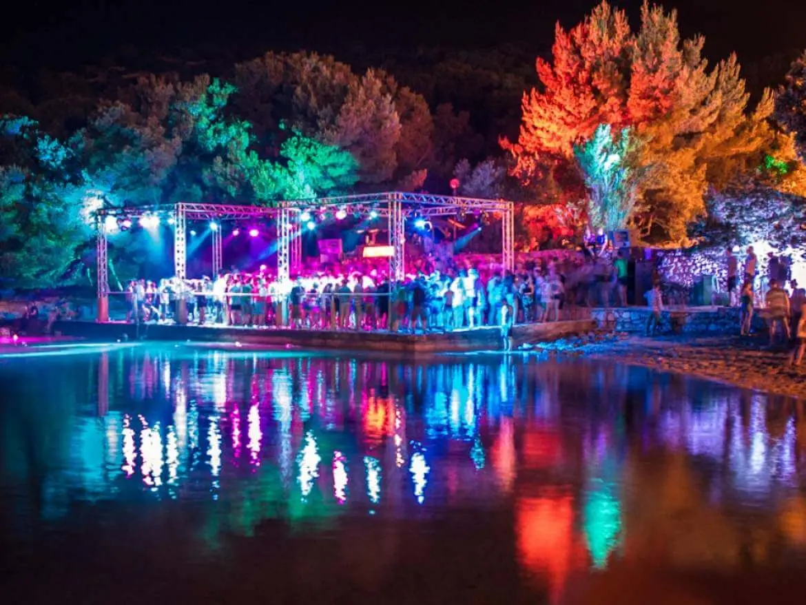 Barbarellas party by the water with many people dancing