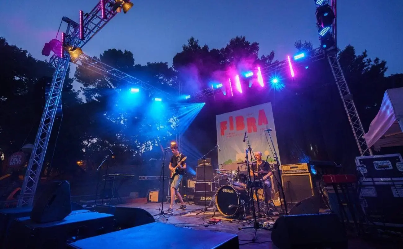 Fibra festival concert stage with band playing on it