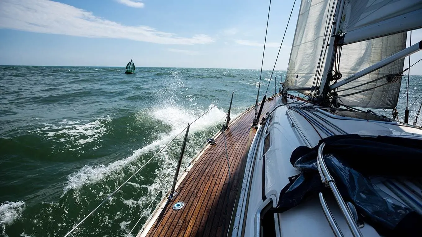 Edge of a boat cruising through waves