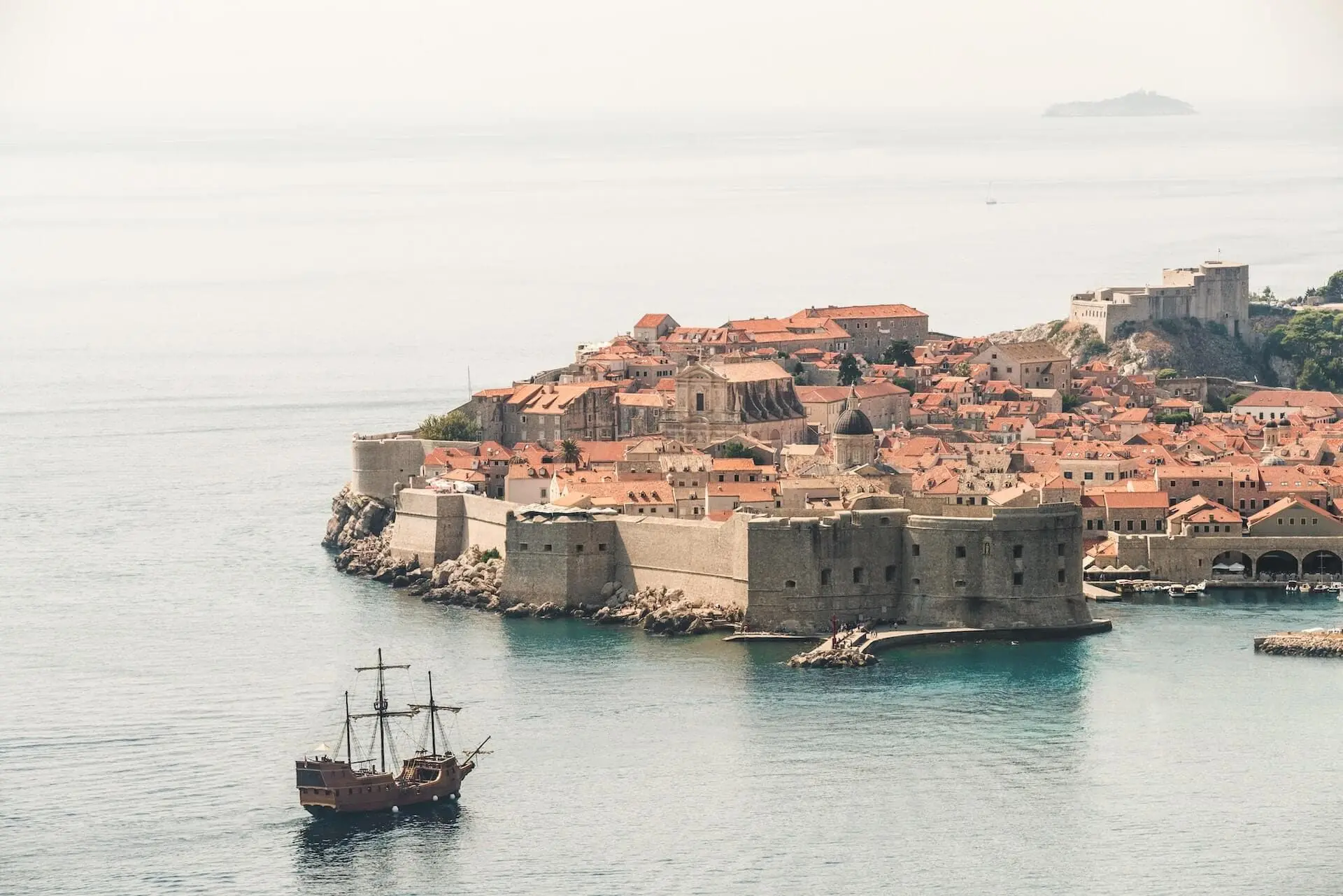 Boat sailing towards old town of Dubrovnik