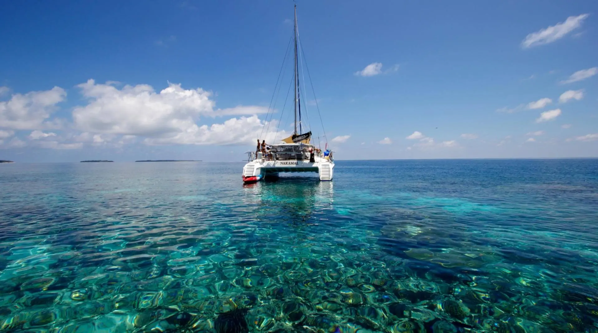 Boat on emerald water sailing 